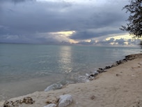Sunset of on the beach in rainy season.