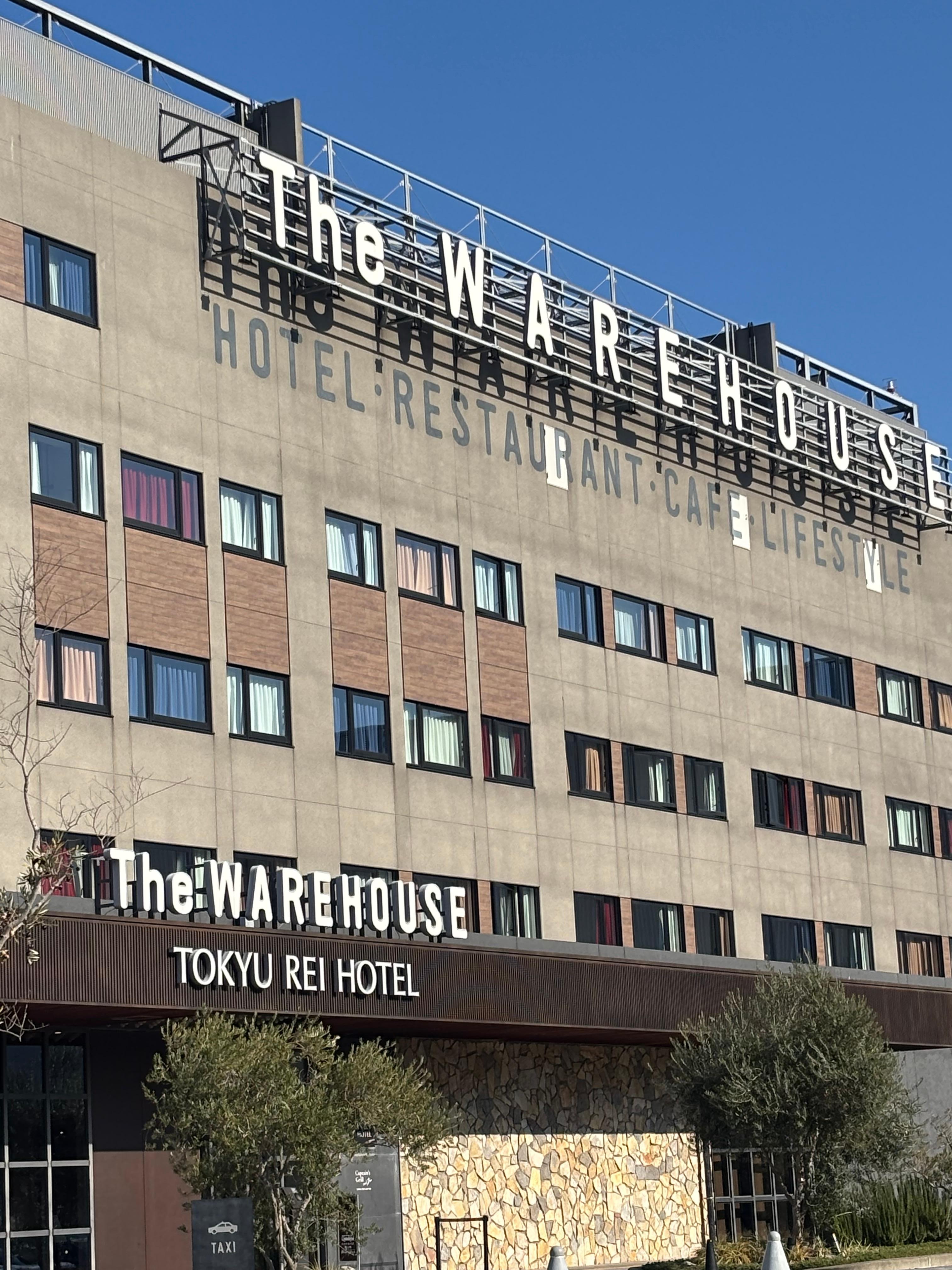 Front of hotel with name show 