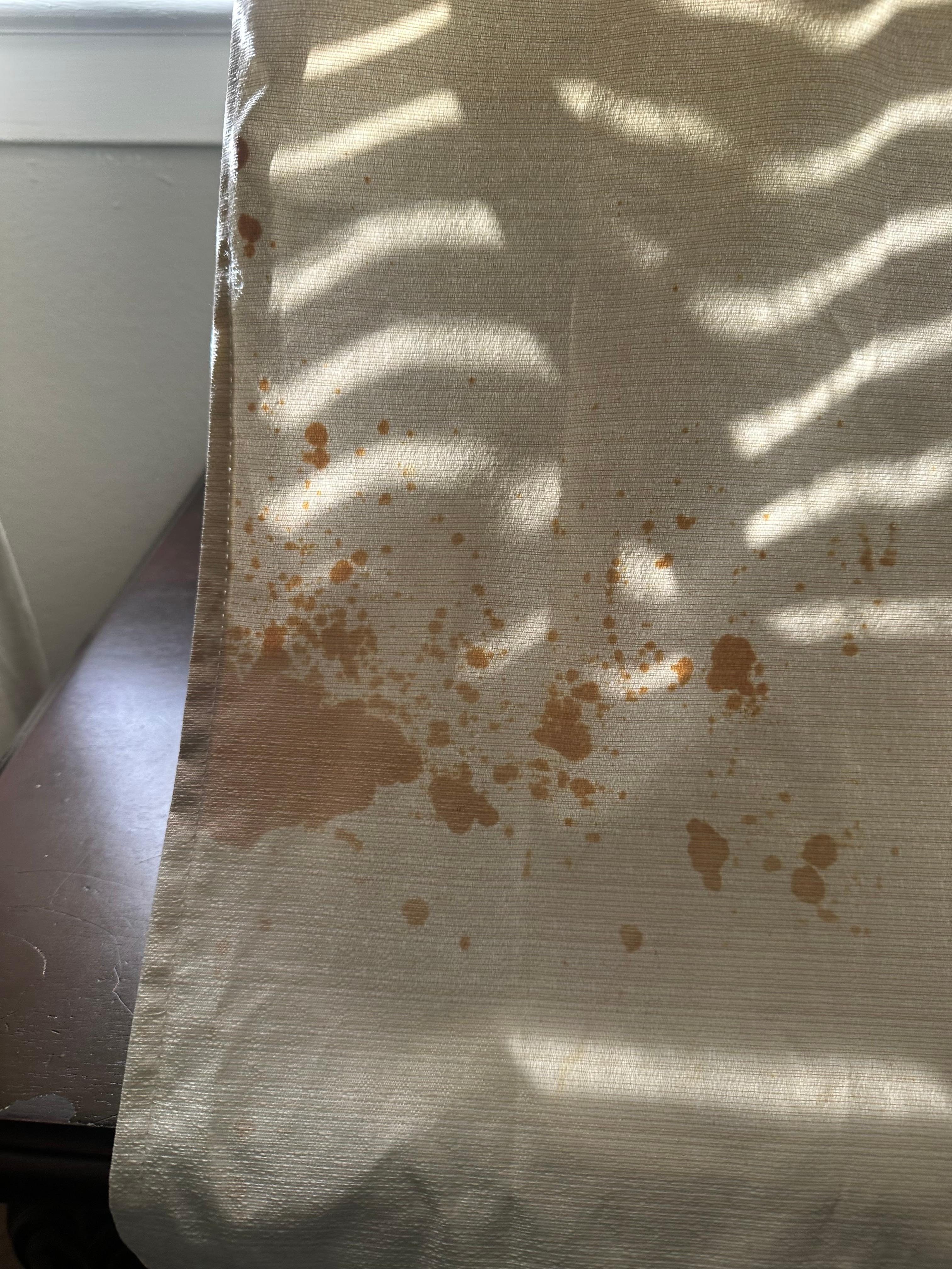 Nasty stained curtain in bedroom. 
