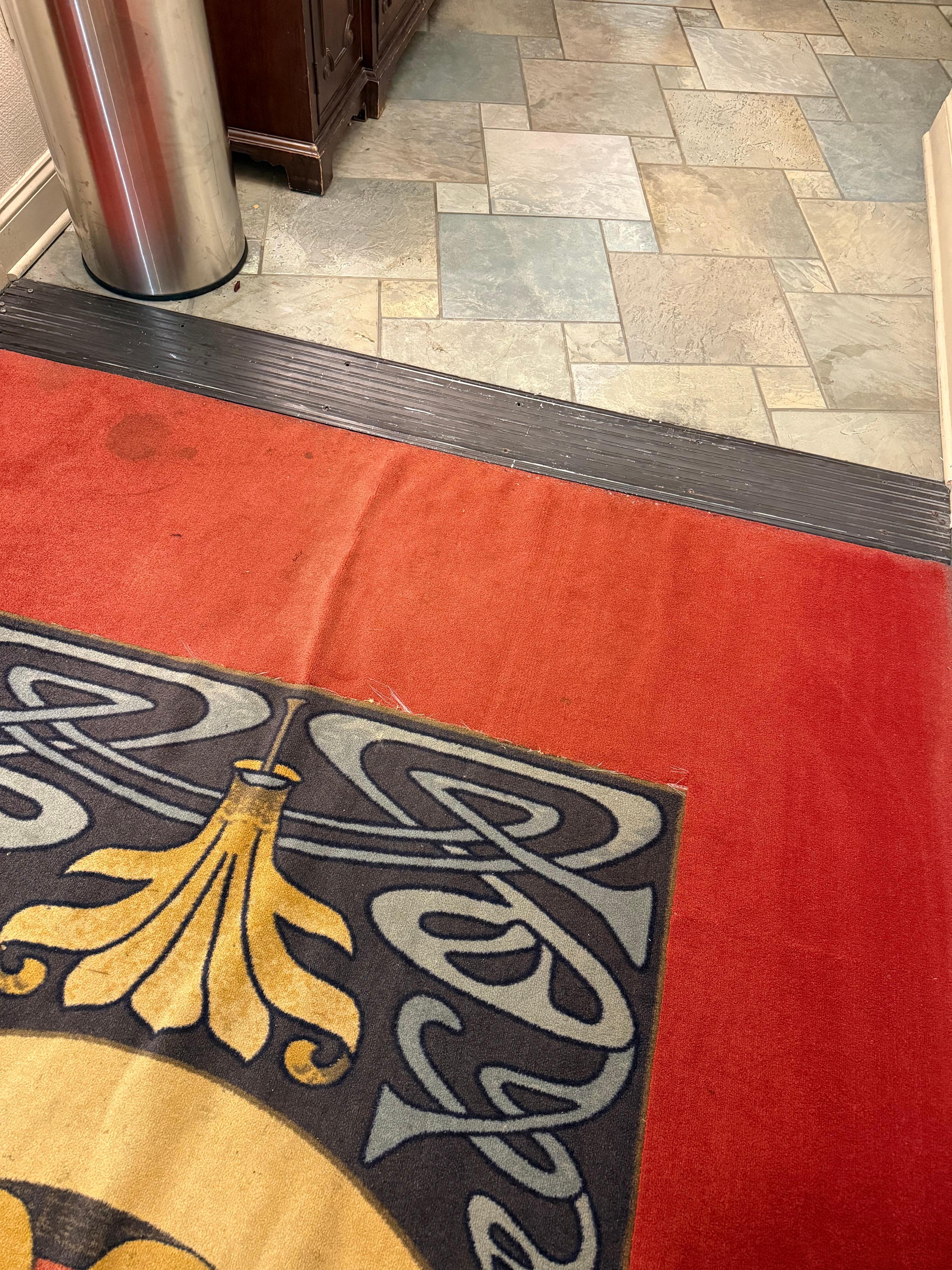 The stained carpet in the hallway. They actually look worse in person than in this picture.