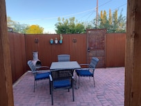 Outdoor patio had a chimney and comfortable chairs