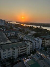 Sunset views of Hue from the rooftop with the Perfume River in sight.