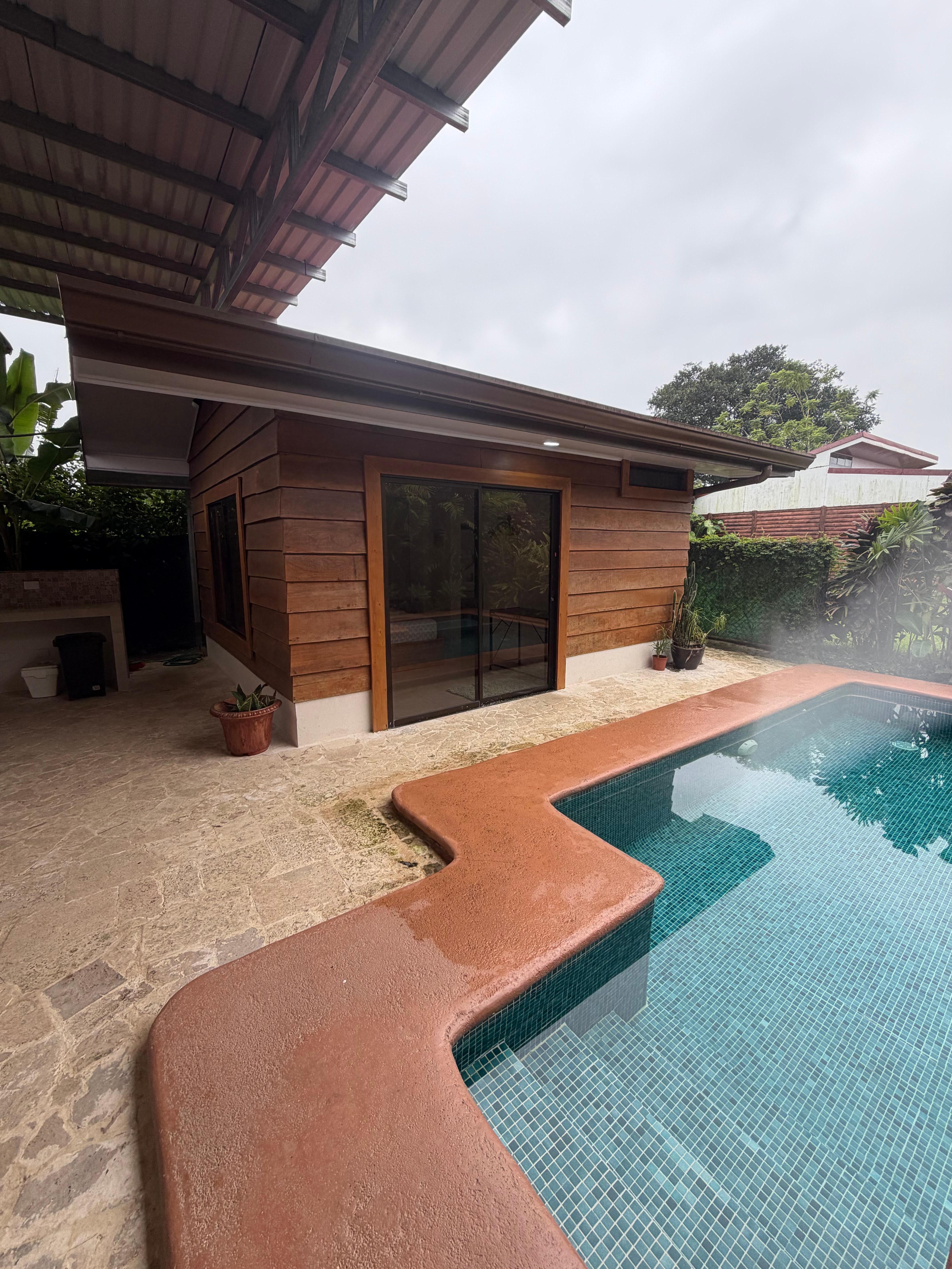 One bedroom is off the main house in a disconnected pool house