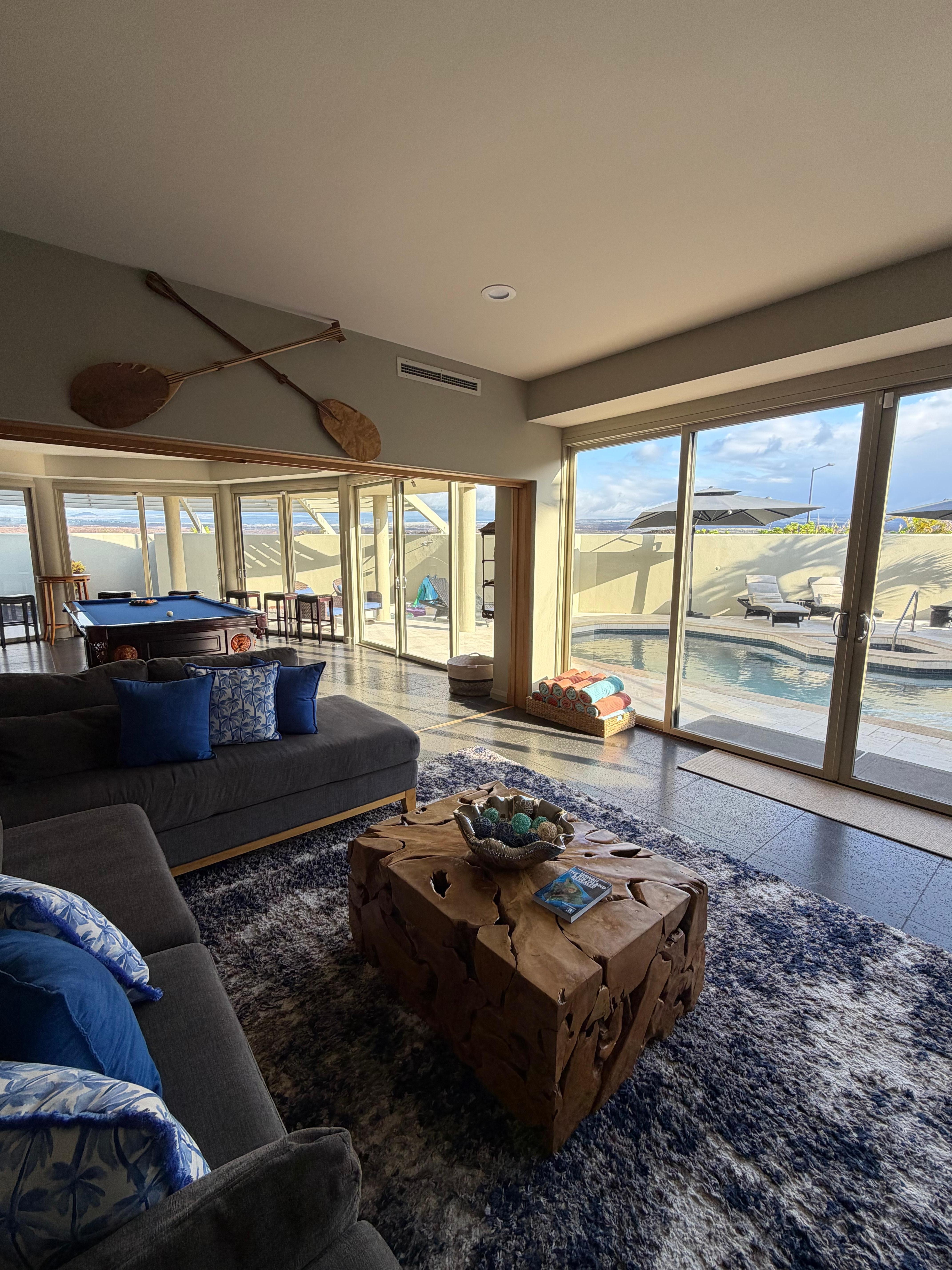 The living room and game room overlooking the pool.