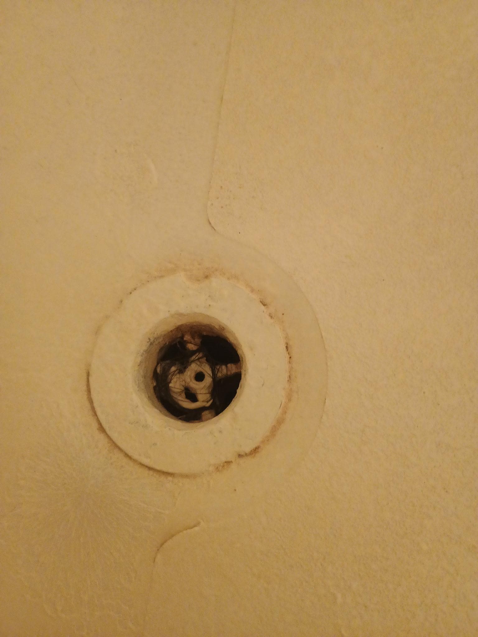 Hair in drain and dirty tub
