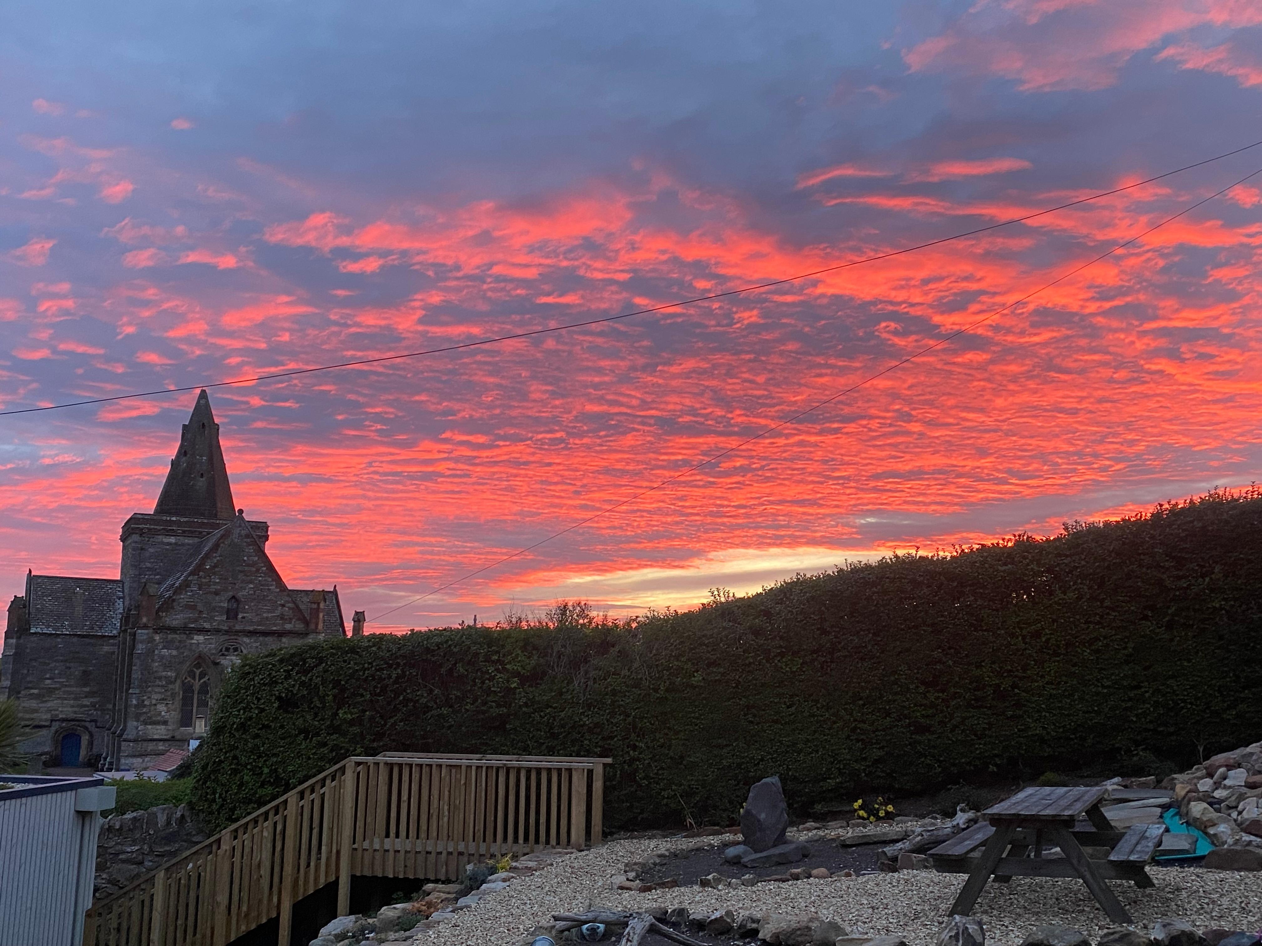 Pic taken from Martha’s Harbor patio of Auld Kirk in beautiful sunset 