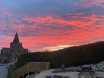 Pic taken from Martha’s Harbor patio of Auld Kirk in beautiful sunset
