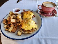 Eggs Benedict with cappuccino