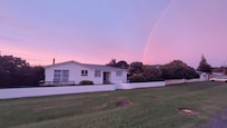Morning rainbow over Dorset St, Opunake