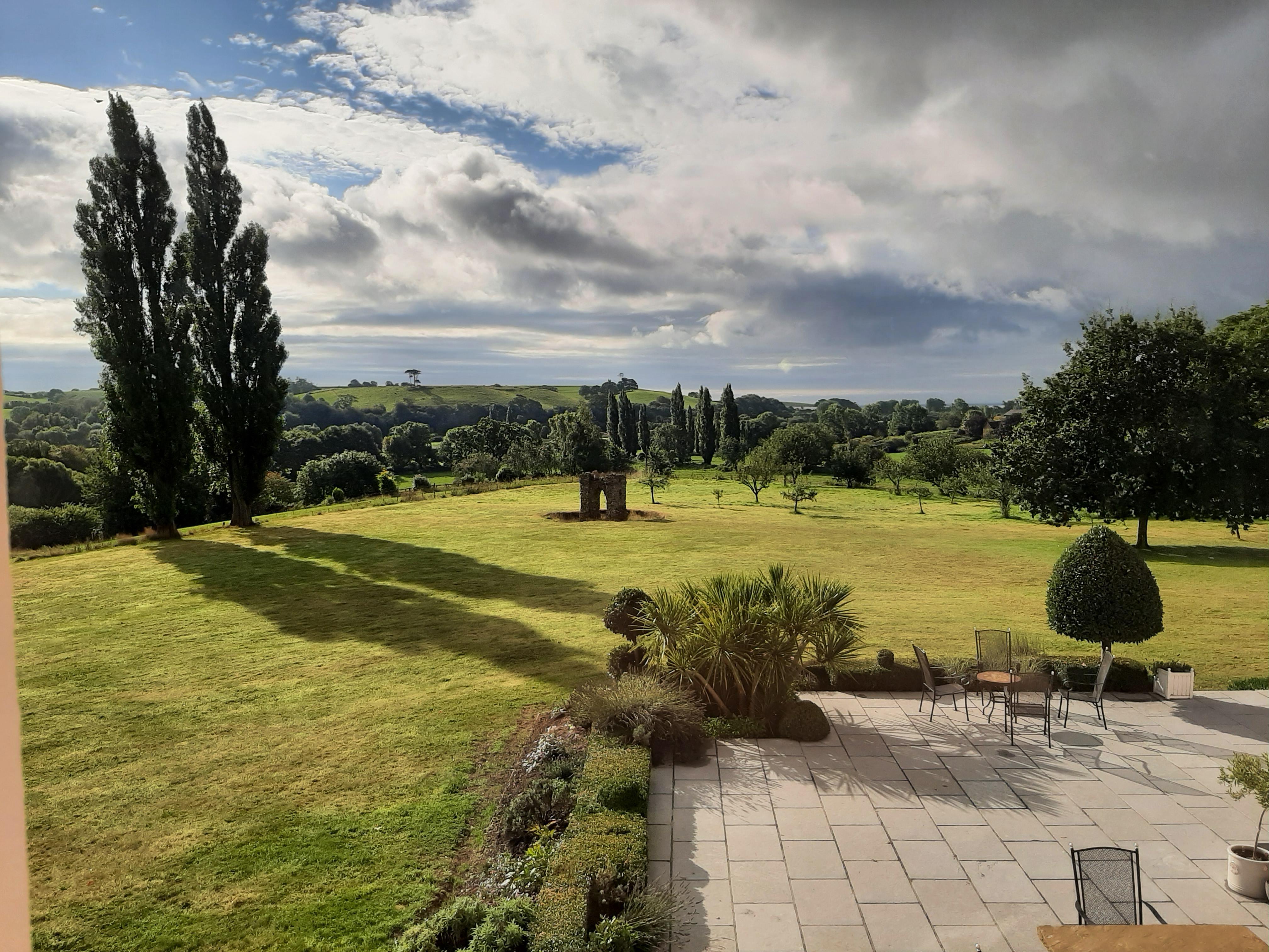 View of Side garden with gate from Old monastery in centre of grass area. Very pleasant surroundings