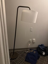 Half the lamps in the room were on their last legs it looked like a thrift store haul