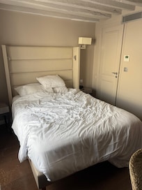 Head board on bed had brown and red stains