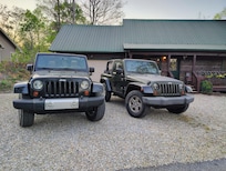 Jeeps and the front of the cabin