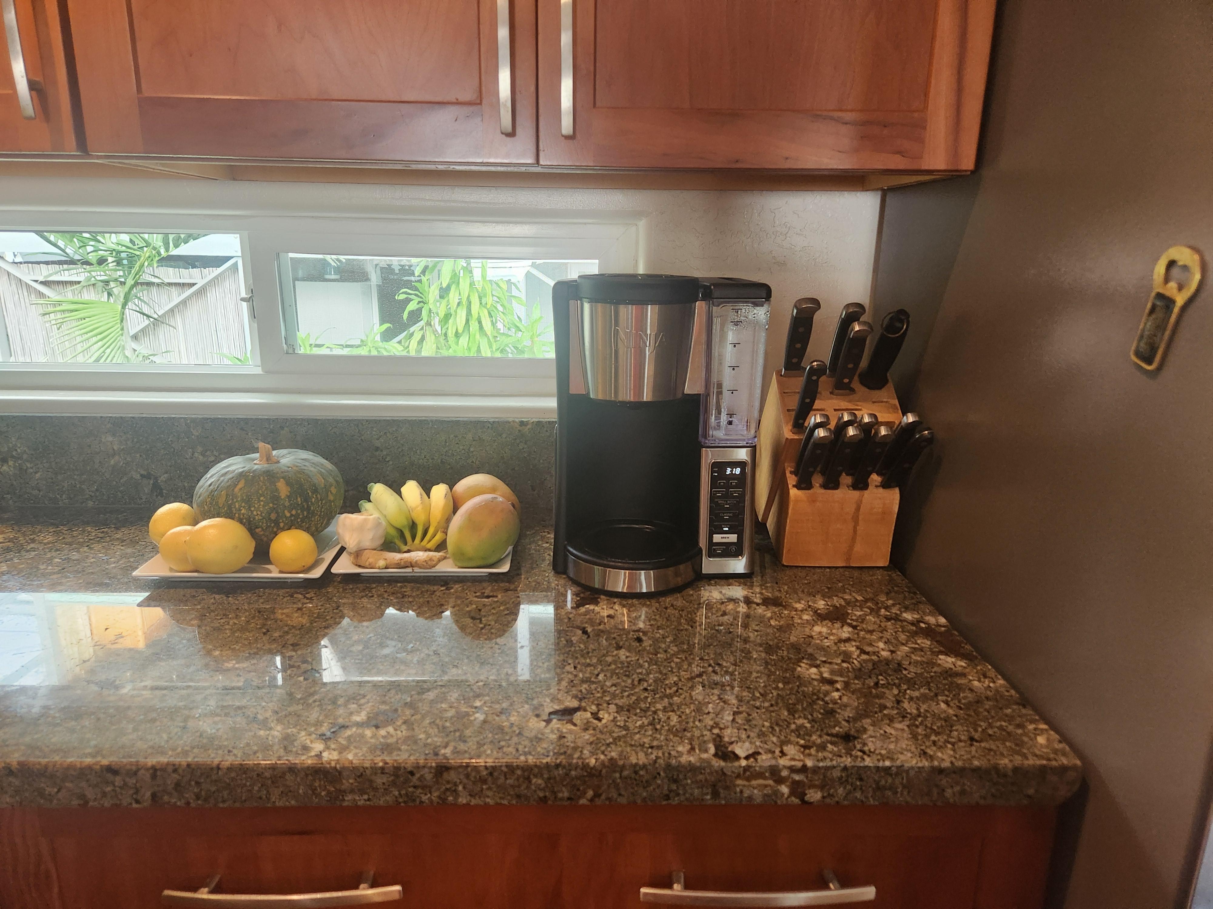 Kitchen corner - with our host's gift, bananas from home tree! 