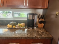 Kitchen corner - with our host's gift, bananas from home tree!