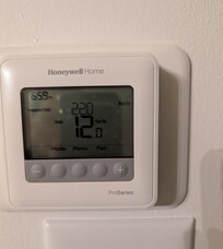 The thermostat after we turned the furnace on.