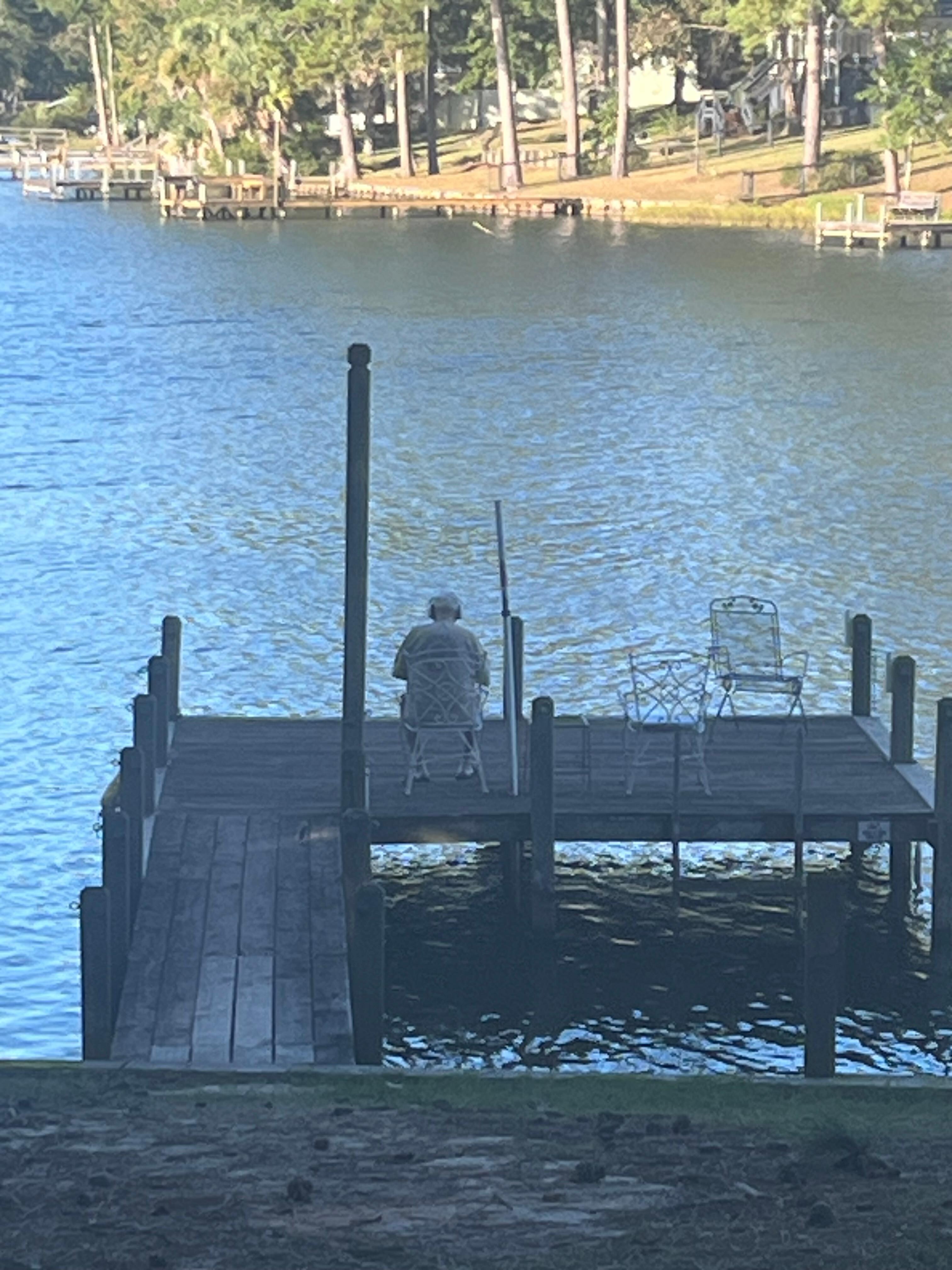 My husband having a contemplative moment on the dock.