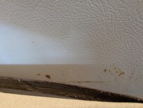 Laminate coming off the countertop. Dirty fridge
