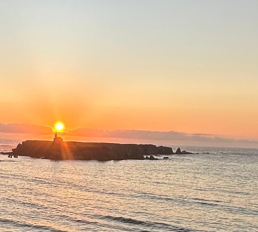 Sunset over the lighthouse as seen from the top deck