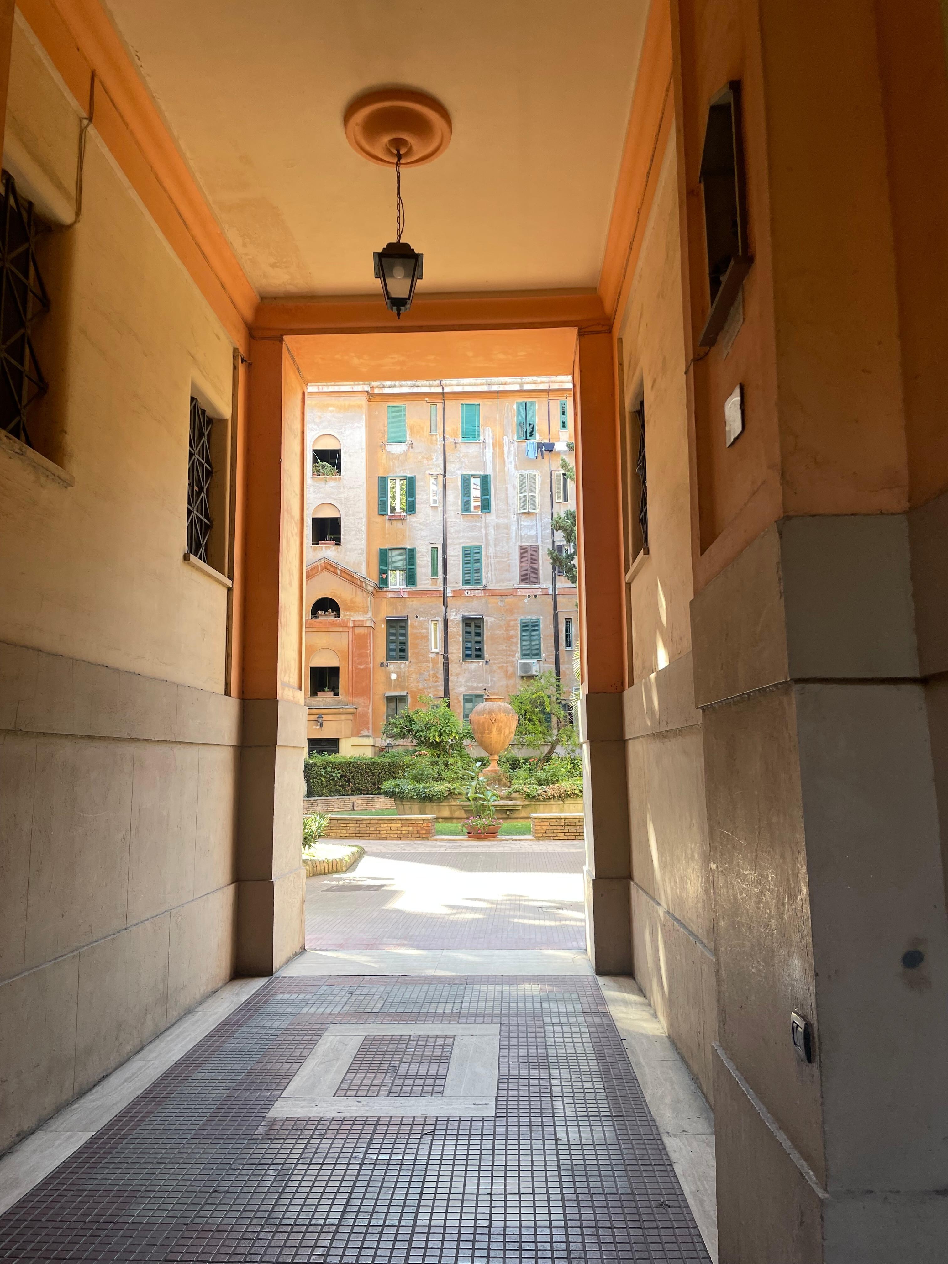 Just inside the street gate