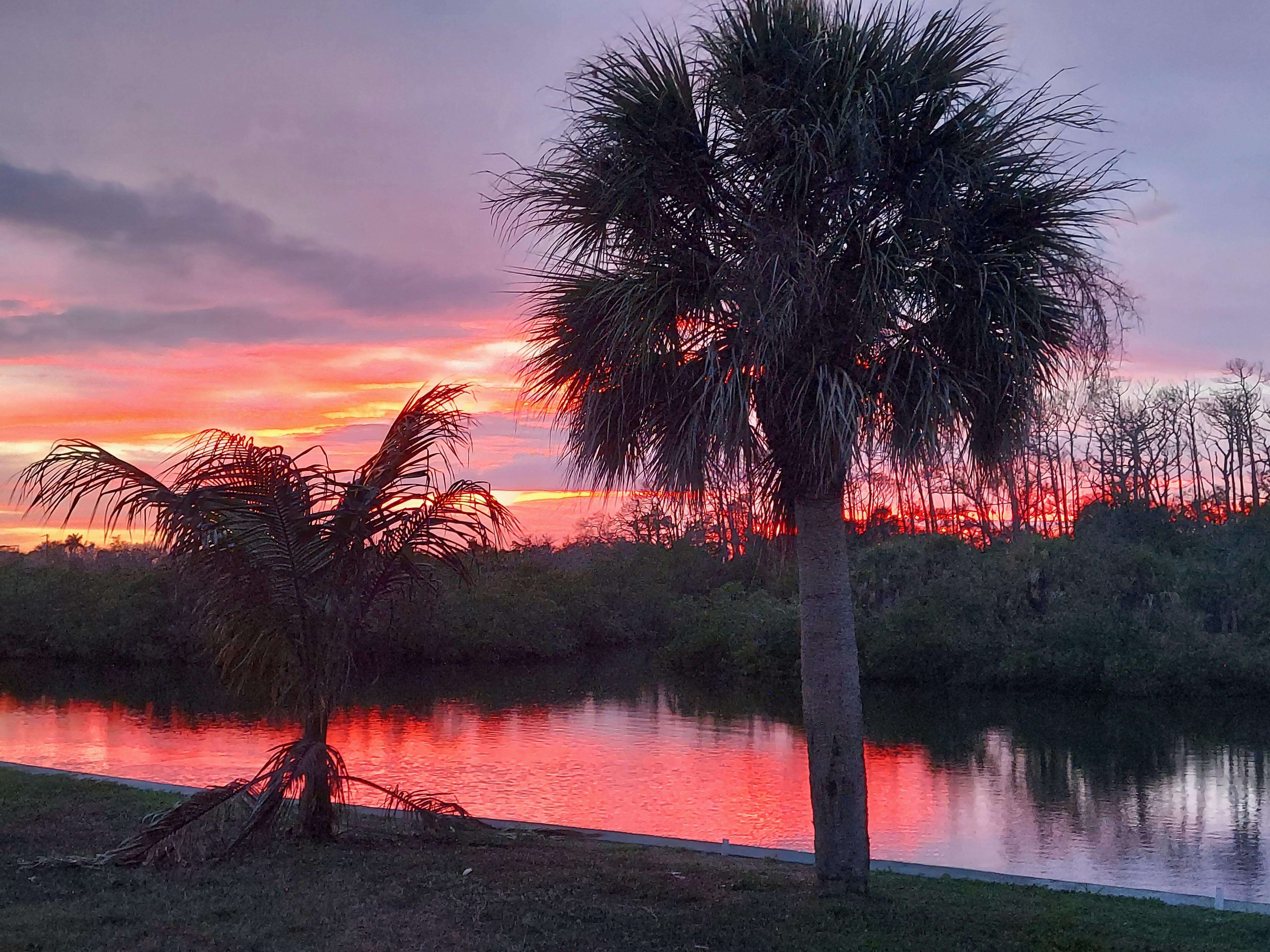 Sunset over the canal in the backyard 