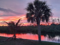 Sunset over the canal in the backyard
