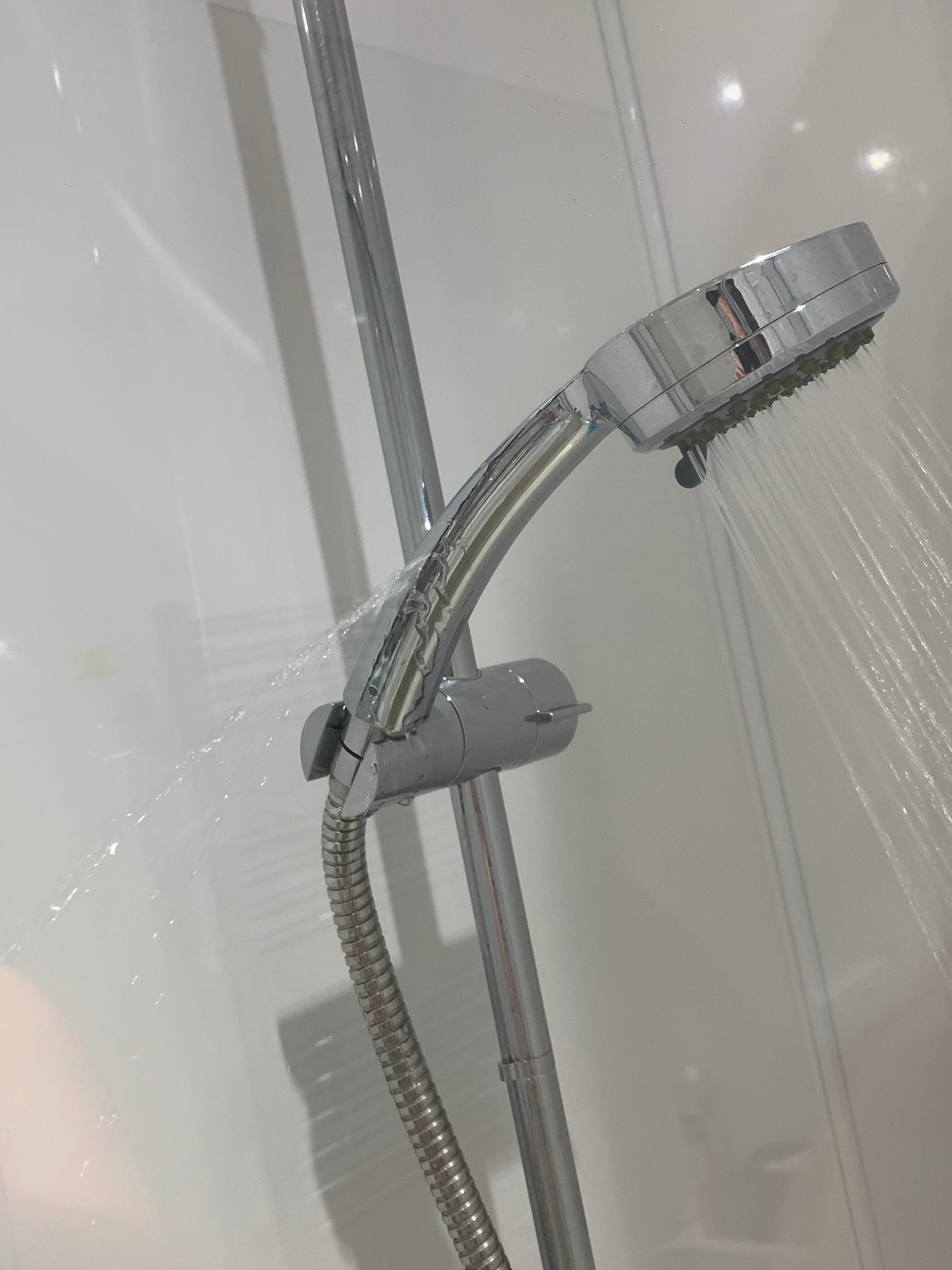 Water coming out of side of shower head. 