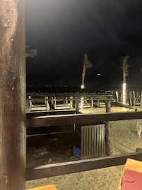 Night view near the hotel entrance from the beach side and pool