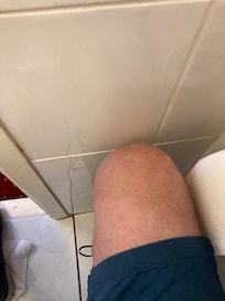 If you sat on the toilet you’re knees hit the wall