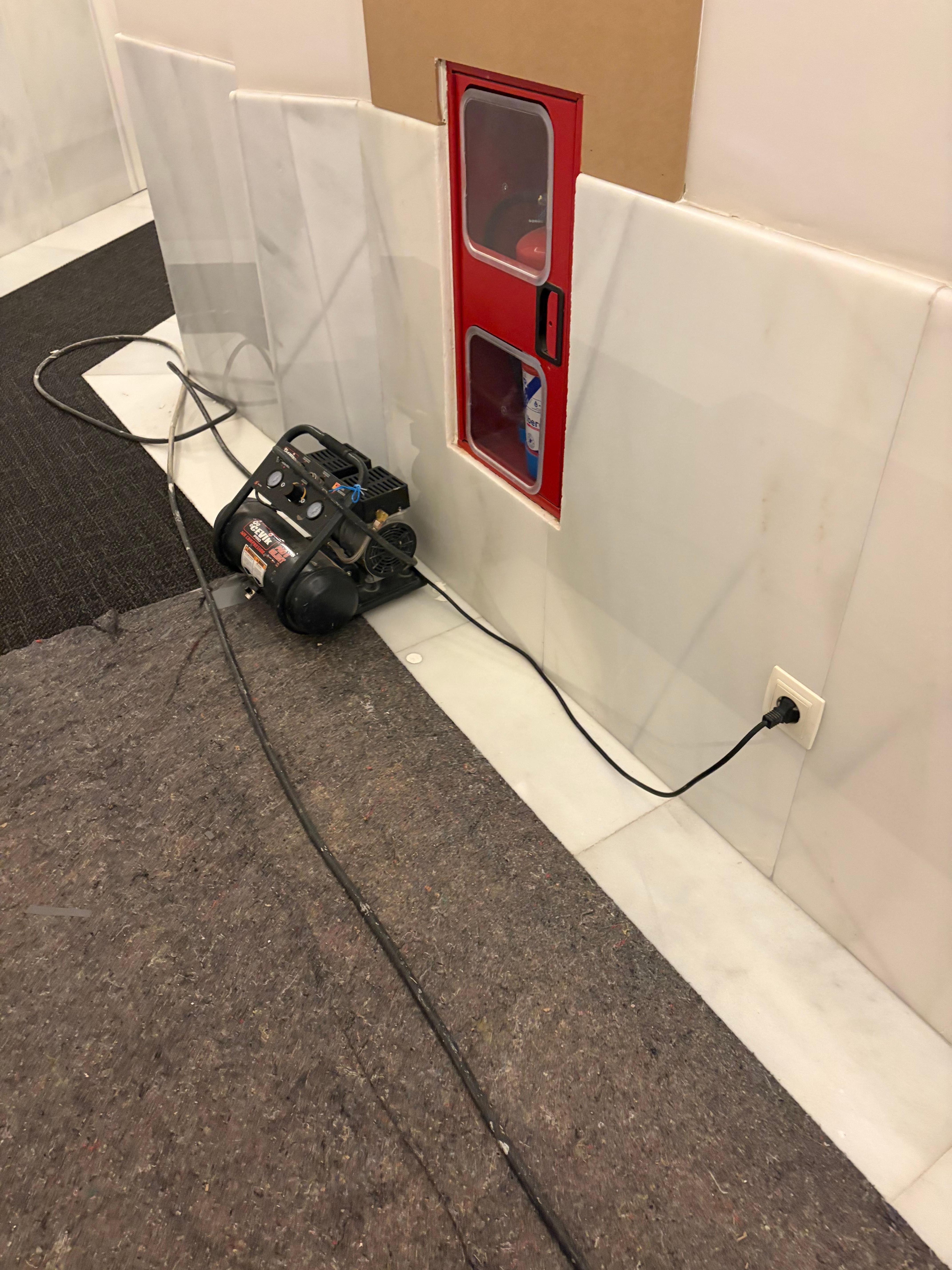 Trim around fire hose installed with compressor while my room other side of wall