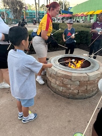 Boys were making s’mores things to the Staff that was helping them