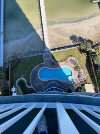 Looking down from balcony to outdoor pool