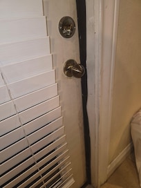 Shabby attempts to fix warped doors and bad door seals