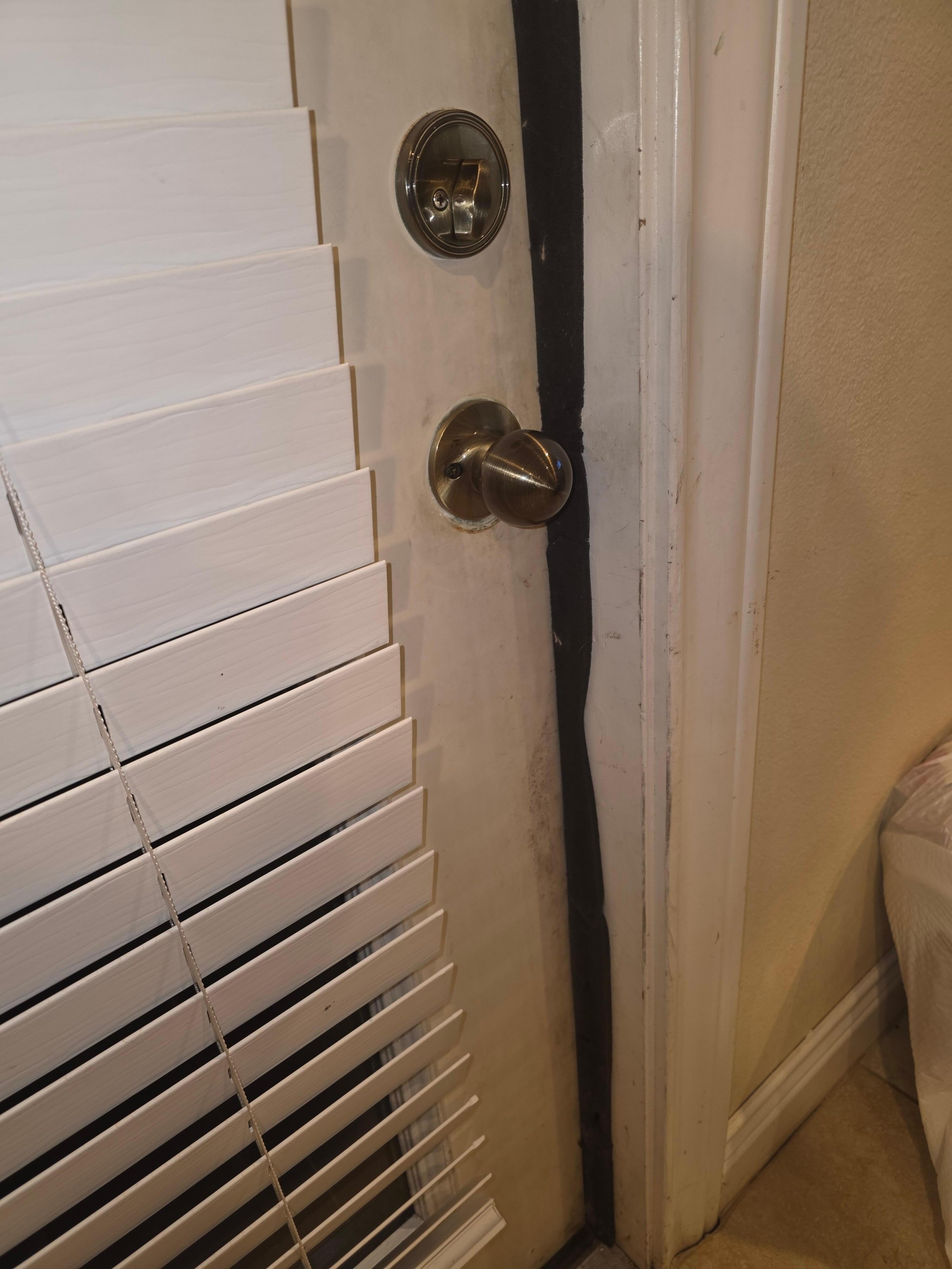 Shabby attempts to fix warped doors and bad door seals