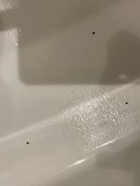 If you make it larger you see three hairs in tub there was also dirt
