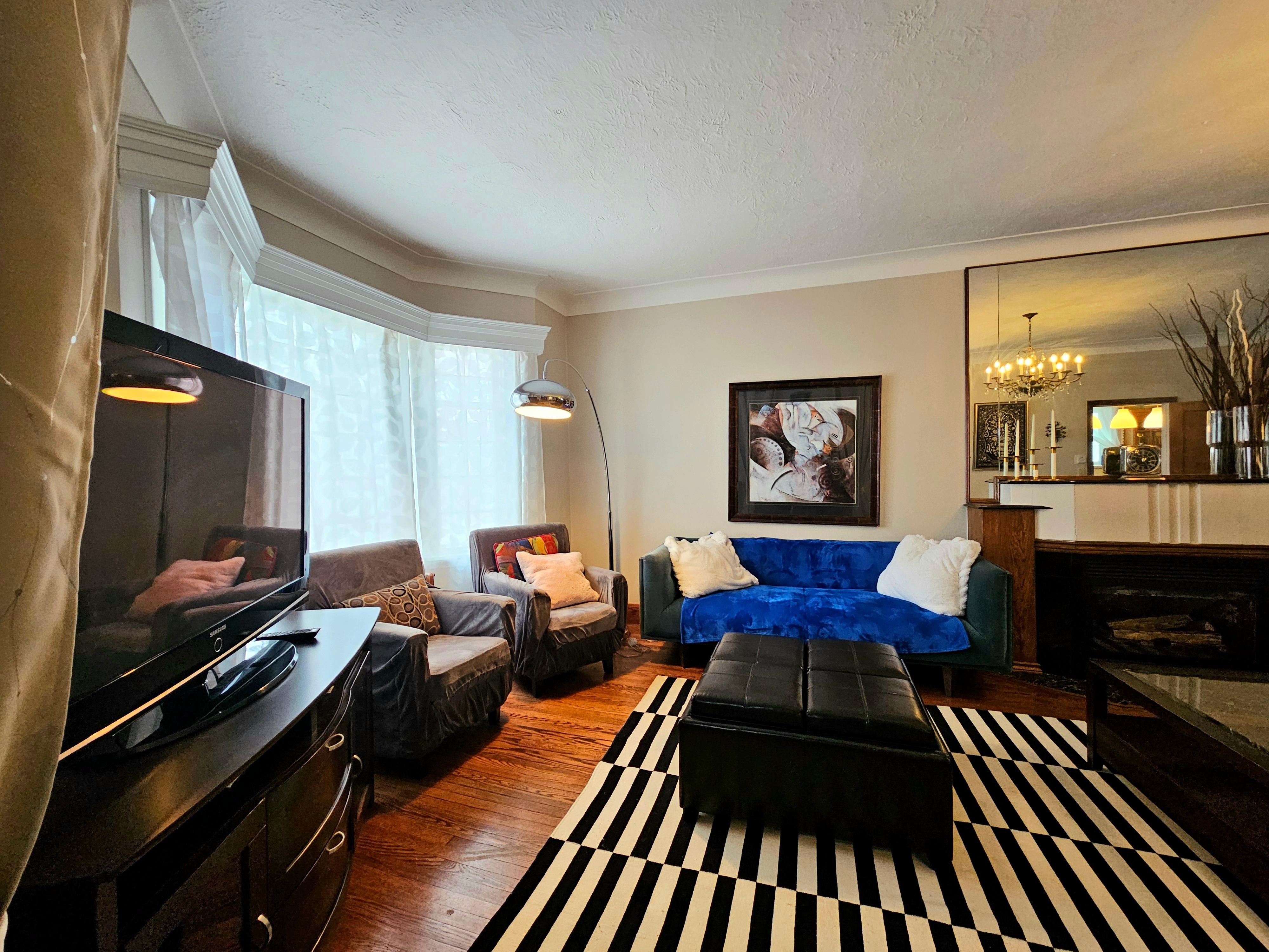 Cozy livingroom with cable tv options, comfy couches. Also, a vacuum to clean up any messes