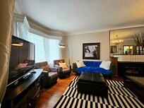 Cozy livingroom with cable tv options, comfy couches. Also, a vacuum to clean up any messes