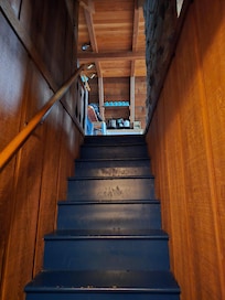 Looking up the stairs from the ground floor into the kitchen on the main floor.