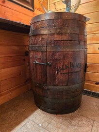 Bathroom sink made from a whiskey barrel.