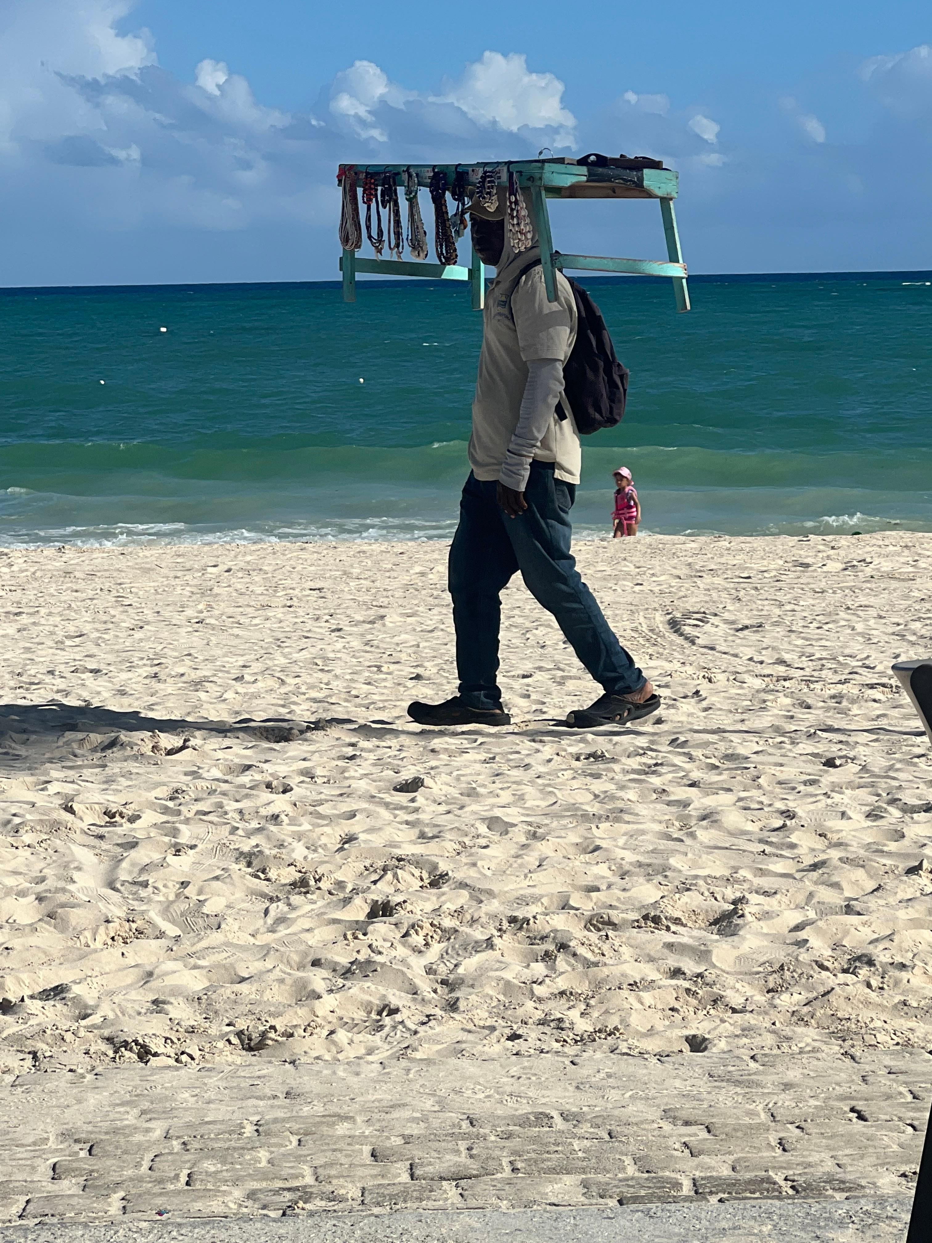 The beach is beautiful. Locals get to sale their goods on the beach.