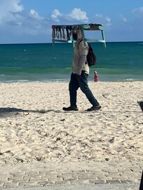The beach is beautiful. Locals get to sale their goods on the beach.