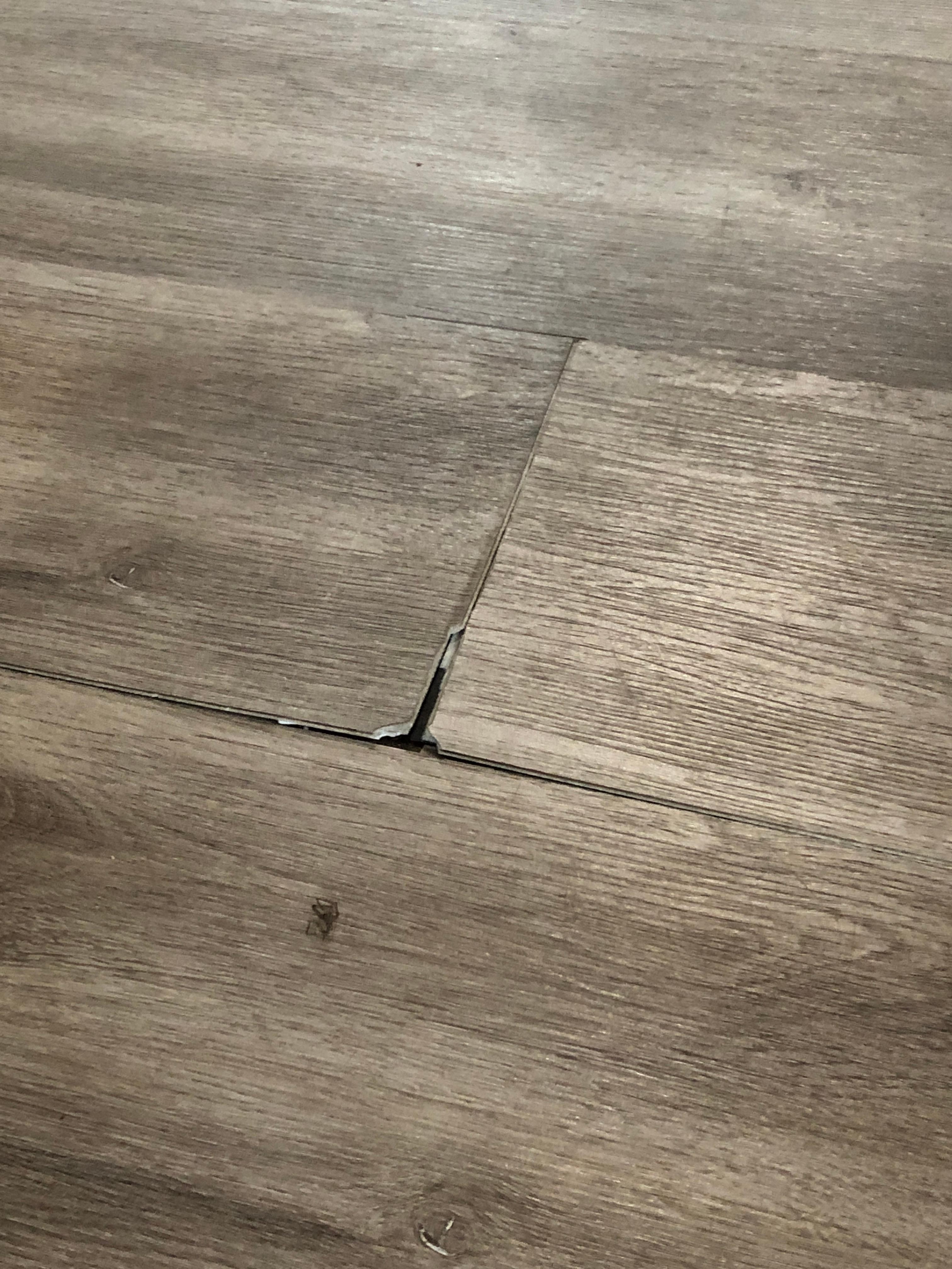 Damaged and lifted floor board