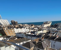 The view from the balcony. Seating available on both and one has a large dining table.