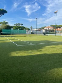 Artificial grass tennis court (there is also a hard court).