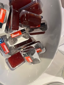 Cold breakfast buffet jam selection with opened sachet