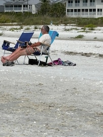 Relaxing on the beach. Appreciated having chairs and an umbrella available.
