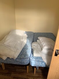 Twin beds the gap between them was tiny.