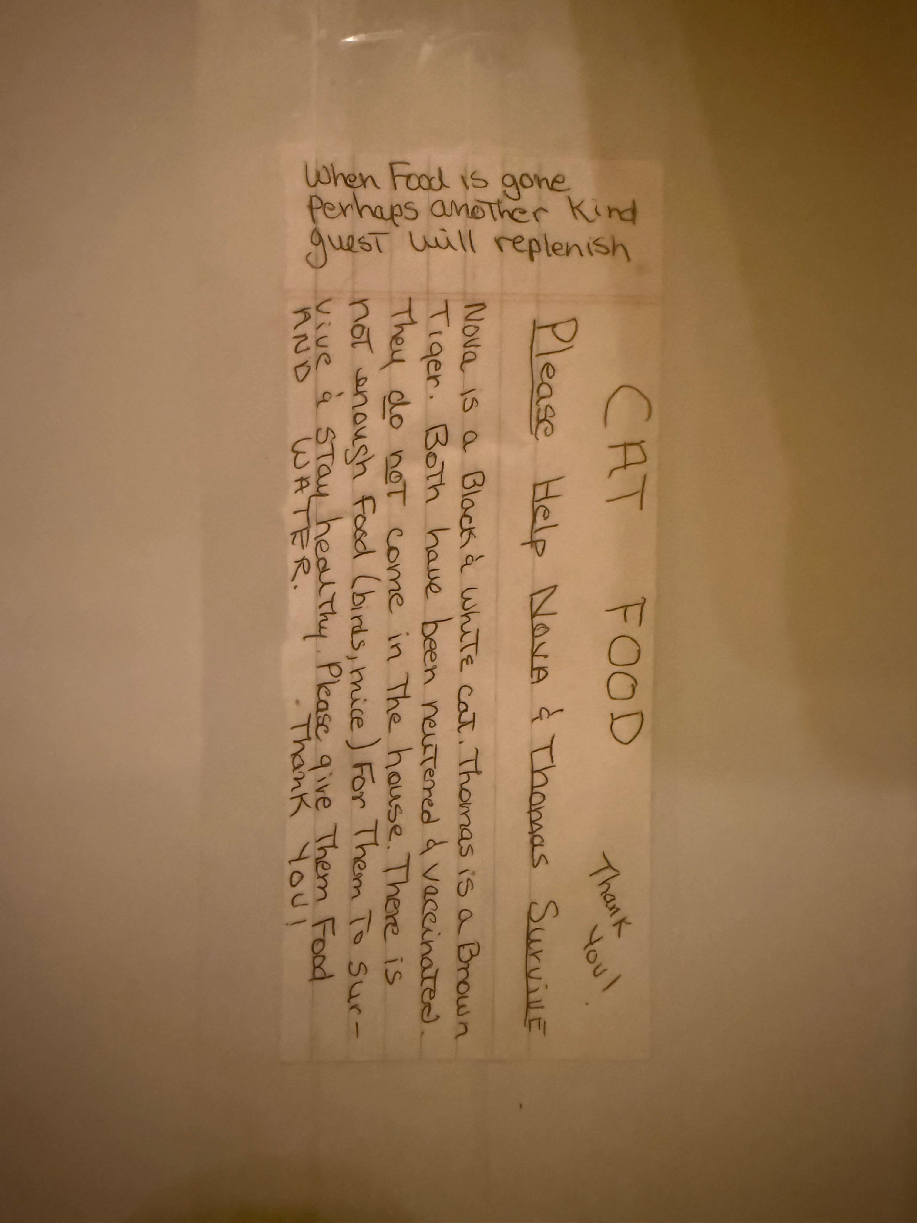 Note from owner to feed and replenish cat food.  No knowledge of cats prior to arriving