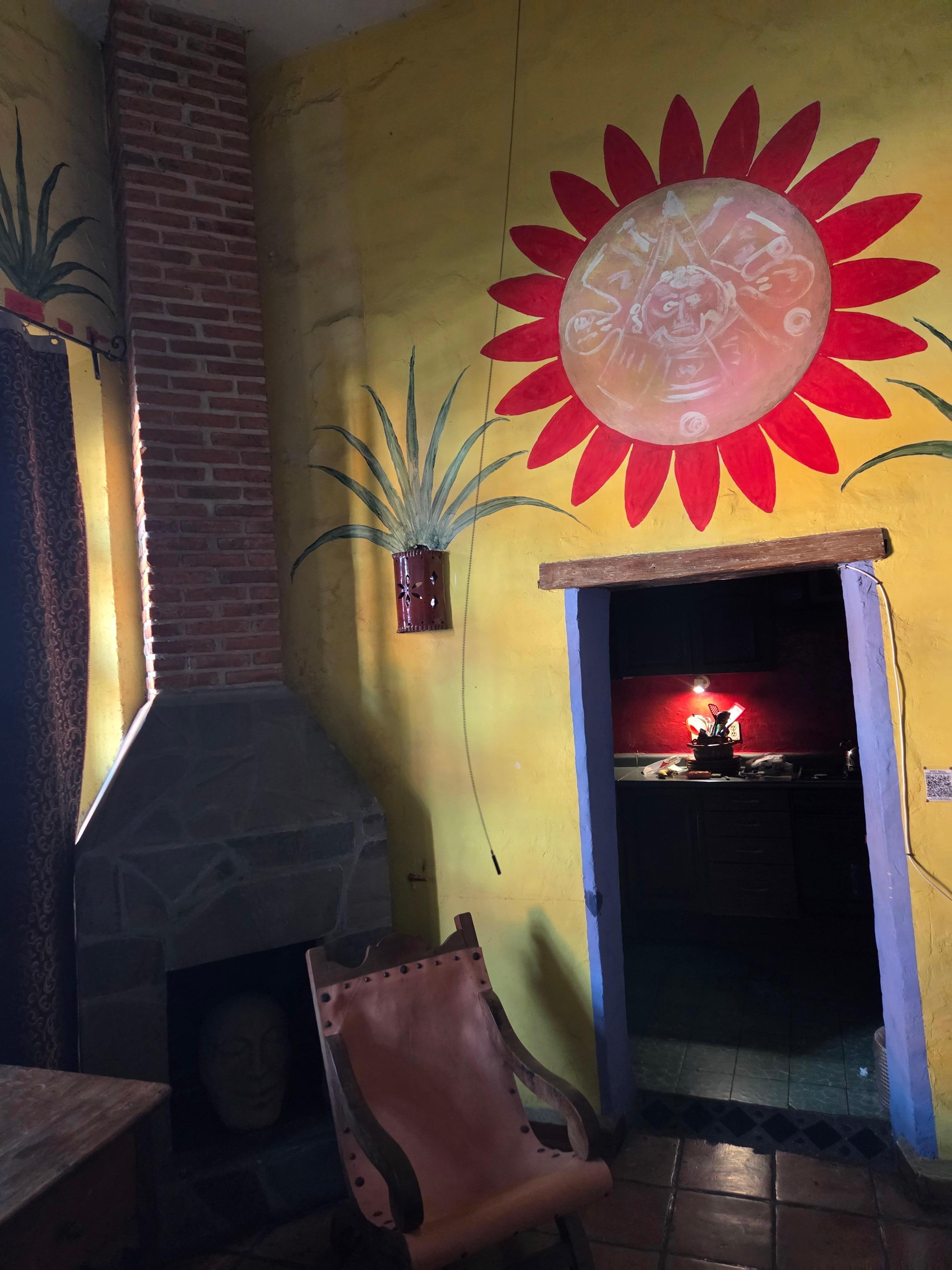 Living room into stocked kitchen.