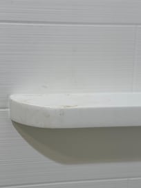 Unclean shelf in shower